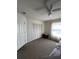Bedroom with bunkbeds with tan carpet and natural light from the window at 121 Loma Bonita Dr, Davenport, FL 33837