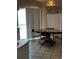 View of dining area with a table and access to a view to the pool and backyard at 121 Loma Bonita Dr, Davenport, FL 33837