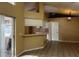 Bright living room featuring tile flooring, a breakfast bar, and sliding door access to the outdoor patio at 121 Loma Bonita Dr, Davenport, FL 33837