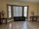 Living room featuring a large window for natural light and neutral decor at 121 Loma Bonita Dr, Davenport, FL 33837