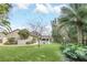 The spacious backyard offers lush landscaping, a private pool, and plenty of room to relax and entertain at 135 James Pl, Maitland, FL 32751
