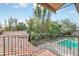 Balcony view overlooking pool and lush greenery providing a serene escape at 135 James Pl, Maitland, FL 32751