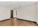 Bedroom with hardwood flooring, neutral walls and entry to other rooms of the home at 135 James Pl, Maitland, FL 32751