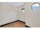 Bedroom with a large round window, recessed lighting and hardwood floors at 135 James Pl, Maitland, FL 32751