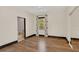 Bedroom with neutral walls, hard wood floors, natural light from the window and en-suite access at 135 James Pl, Maitland, FL 32751
