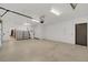 Spacious, clean garage with epoxy floor, ample storage, and access to the house at 135 James Pl, Maitland, FL 32751