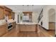 Gourmet kitchen with a large center island, stainless steel appliances, and custom cabinetry at 135 James Pl, Maitland, FL 32751