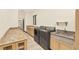 Laundry room featuring cabinetry and counter space, modern washer and dryer at 135 James Pl, Maitland, FL 32751
