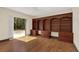 Office with custom built-in shelving and large windows offering lots of natural light at 135 James Pl, Maitland, FL 32751