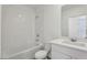 Bright bathroom with a shower and a white sink at 1522 Mermaid Way, Haines City, FL 33844