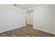 Bedroom features neutral walls and flooring, and an open door to the hallway at 1522 Mermaid Way, Haines City, FL 33844