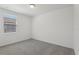 Bedroom features neutral walls and flooring with a window for natural light at 1522 Mermaid Way, Haines City, FL 33844