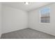 Bedroom features neutral walls and carpet, and a window for natural light at 1522 Mermaid Way, Haines City, FL 33844