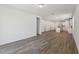 Open living space boasts stylish, wood-look tile flooring that connects multiple rooms at 1522 Mermaid Way, Haines City, FL 33844