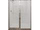Bright shower with white tiles and a shower door at 1522 Mermaid Way, Haines City, FL 33844
