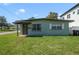 Charming single-story home featuring a well-kept lawn, neutral paint, and a covered front porch at 1600 Hart Ln, Orlando, FL 32804