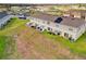 Aerial view of a townhome's fenced backyard space, with the installation of solar panels on the roof at 1623 Mirabella Cir, Davenport, FL 33897