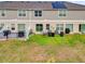 Aerial view of backyards showing privacy fences, patios, well-maintained lawns, and modern home exteriors at 1623 Mirabella Cir, Davenport, FL 33897