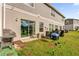 Spacious backyard with patio, sliding glass door to home's interior, and well-maintained lawn at 1623 Mirabella Cir, Davenport, FL 33897