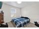 Bedroom with neutral walls and carpet, a large window for natural light, and an inviting bed at 1623 Mirabella Cir, Davenport, FL 33897