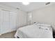 Bedroom with neutral walls and carpet, a large closet, and an inviting bed at 1623 Mirabella Cir, Davenport, FL 33897