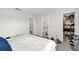 Bedroom showing ensuite bathroom and closet, neutral walls and carpet, and an inviting bed at 1623 Mirabella Cir, Davenport, FL 33897