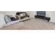 Comfortable living room with tile flooring, two couches, a flat screen tv and a minimalist decor at 1623 Mirabella Cir, Davenport, FL 33897
