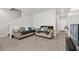 Cozy living room featuring tile floors, neutral paint, comfortable seating and a staircase at 1623 Mirabella Cir, Davenport, FL 33897