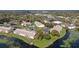 Scenic aerial view of condo community nestled beside a pond, offering peaceful living and easy access at 165 N Pearl Lake Cswy # 202, Altamonte Springs, FL 32714