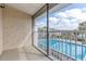 Relaxing balcony view showcasing the community pool and sunny skies with white railing at 165 N Pearl Lake Cswy # 202, Altamonte Springs, FL 32714