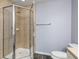 Bathroom featuring a glass-enclosed shower with tile surround and modern fixtures at 165 N Pearl Lake Cswy # 202, Altamonte Springs, FL 32714