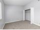 Bedroom featuring neutral walls and carpet, plus a closet for clothes storage at 165 N Pearl Lake Cswy # 202, Altamonte Springs, FL 32714
