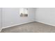 Bright bedroom showcases neutral walls, carpet, and a window for natural light at 165 N Pearl Lake Cswy # 202, Altamonte Springs, FL 32714