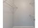 Walk-in closet shows wire shelving for organized storage of clothes and accessories at 165 N Pearl Lake Cswy # 202, Altamonte Springs, FL 32714