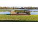 Picturesque lake deck with wooden rails offers relaxing lake views and a tranquil outdoor space at 165 N Pearl Lake Cswy # 202, Altamonte Springs, FL 32714