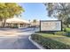 Community entrance to The Cove at Pearl Lake, a condominium community, with manicured landscaping at 165 N Pearl Lake Cswy # 202, Altamonte Springs, FL 32714