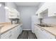 Efficient kitchen with white appliances and ample cabinet space providing practical functionality at 165 N Pearl Lake Cswy # 202, Altamonte Springs, FL 32714