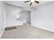 Open-concept living room featuring neutral tones and a breakfast bar, perfect for modern living at 165 N Pearl Lake Cswy # 202, Altamonte Springs, FL 32714