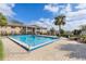 Community pool area with lounge chairs offers a refreshing outdoor space for relaxation and recreation at 165 N Pearl Lake Cswy # 202, Altamonte Springs, FL 32714