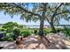 Spacious wooden deck overlooking a serene lake with mature trees at 17201 Magnolia Island Blvd, Clermont, FL 34711