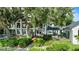 Stunning backyard with large windows, deck, spa, and lush landscaping at 17201 Magnolia Island Blvd, Clermont, FL 34711