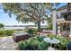 Relaxing backyard patio with hot tub, outdoor seating, and beautiful lake views at 17201 Magnolia Island Blvd, Clermont, FL 34711