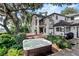 Luxurious backyard featuring a hot tub, patio, and well-manicured landscaping at 17201 Magnolia Island Blvd, Clermont, FL 34711