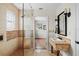 Updated bathroom with a glass shower, mosaic tile accents, and modern fixtures at 17201 Magnolia Island Blvd, Clermont, FL 34711