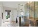 Modern bathroom with a glass-enclosed shower and access to the outdoors at 17201 Magnolia Island Blvd, Clermont, FL 34711