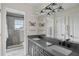 Modern bathroom with double sinks, vanity and large glass shower at 17201 Magnolia Island Blvd, Clermont, FL 34711