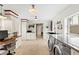 Spacious laundry room with built in desk, modern fixtures and stainless steel appliances at 17201 Magnolia Island Blvd, Clermont, FL 34711