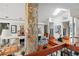 Open-concept living room with stone accents, high ceilings, and modern decor at 17201 Magnolia Island Blvd, Clermont, FL 34711