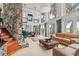 Spacious living area with stone accents, dining area, and natural light at 17201 Magnolia Island Blvd, Clermont, FL 34711