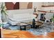 Well-lit living room features hardwood floors, modern decor and an open floor plan at 17201 Magnolia Island Blvd, Clermont, FL 34711